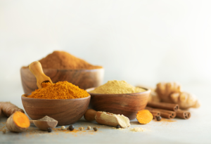 variety of ground spices in bowls
