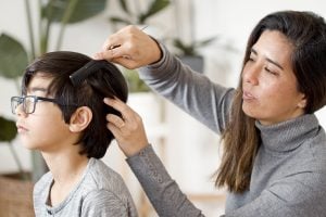 mother combs son's hair