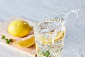 glass of water with lemon and mint
