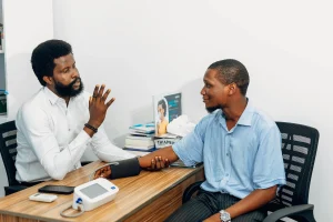 doctor consults with patient on blood pressure levels